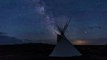 Milky Way hovers over distant thunderstorm