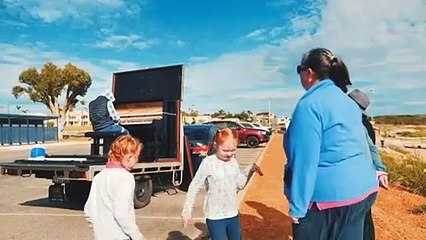 Mining engineer plays piano by the beach in small WA town