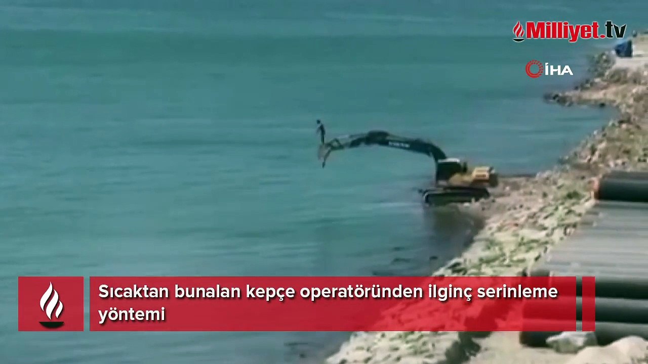 Sıcaktan bunalan kepçe operatöründen ilginç serinleme yöntemi