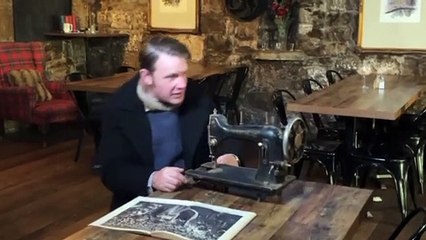 Inspecting an antique sewing machine