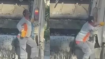 Temizlik görevlisi çöp arabasının üzerinde müzik dinleyip kendinden geçti