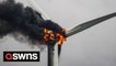 Wind turbine that caught fire spreading thick black smoke across a UK city