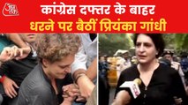 Priyanka Gandhi Vadra sits on a protest with other leaders