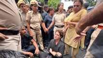 Priyanka Gandhi refuses to budge as police try to detain her