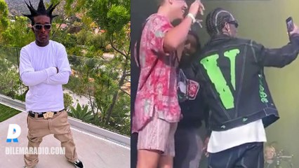 Lil Uzi Vert poses with a fan who ran onstage during his performance