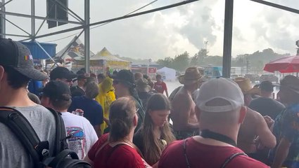 Fans take cover as storm delays Michigan race