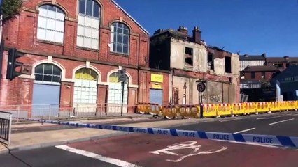Video shows remains of devastated building after suspected arson attack in the city centre