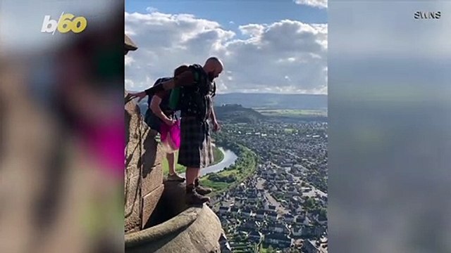 Thrill-seekers Dressed in Kilts Base Jump From the Top of the William Wallace Monument in Stirling