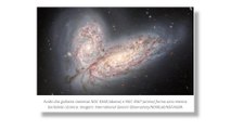 Colisão de galáxias forma borboleta cósmica brilhante