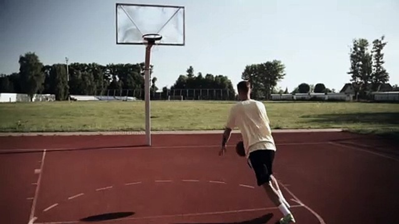 a man playing a game of basketball