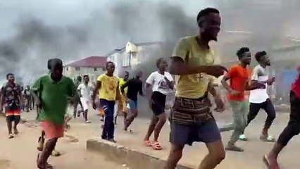 Moment Sierra Leone police appears to fire gun during protests
