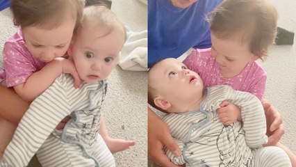 'Overprotective toddler doesn't let dad hold her baby brother '