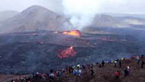 Tourists flock to erupting volcano in Iceland