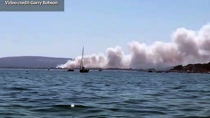 Smoke rising from fire at Studland Heath, close to popular Dorset beach