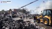 Firefighters douse the flames after an explosion at a market in Yerevan