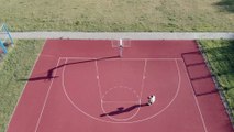 a man shooting a basketball with a jump shot