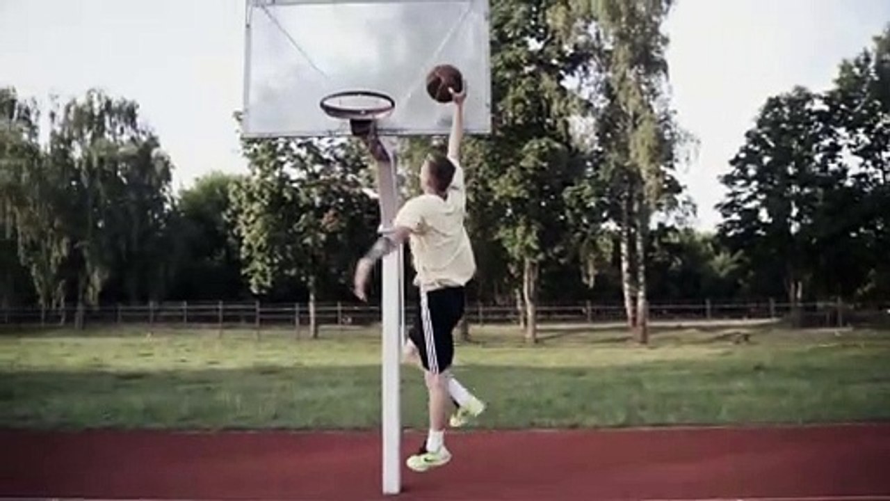 a man dunking a basketball