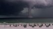 Large waterspout looms offshore