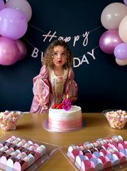 Little Girl Surprised by Stubborn Birthday Candle