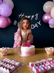 Little Girl Surprised by Stubborn Birthday Candle