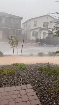 Sideways rain in Queen Creek by Sarah Harshey