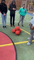 Mesmerizing Stack of Basketballs Roll Together