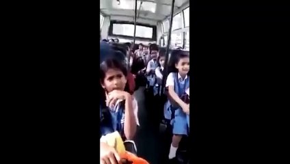 Young little school girls chanting Bhagavad Gita in the school bus