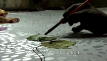 Artisans paint motifs on a Banarasi silk saree - Varanasi