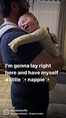 Baby preciously naps with smile on his face