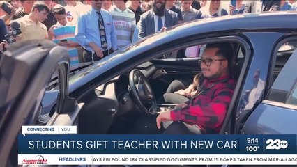 Students gift teacher with new car