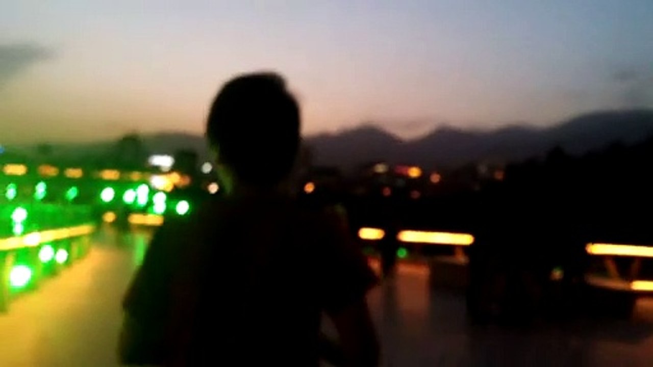 Green illumination on bridge at night