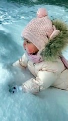 Baby loves snow, puts entire face in it