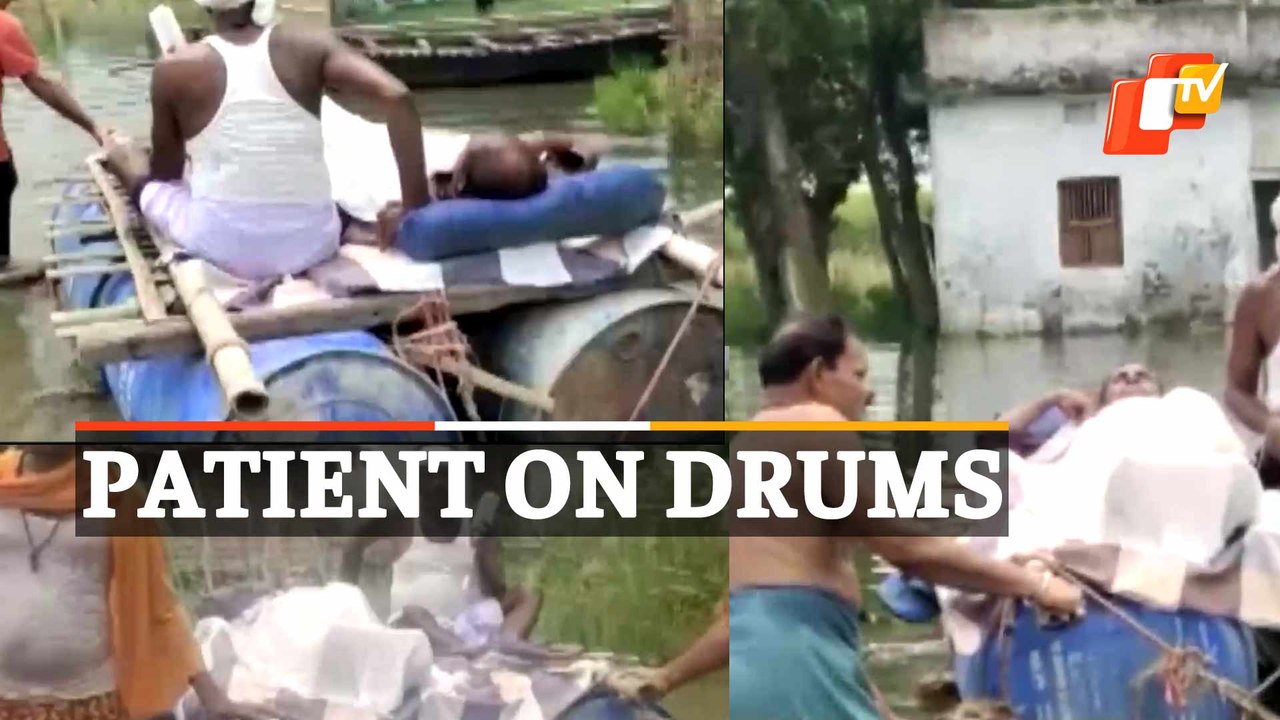 Patient Carried On Drums In Flood-Hit Madrauni...
