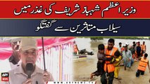 Prime Minister Shehbaz Sharif talks to flood victims