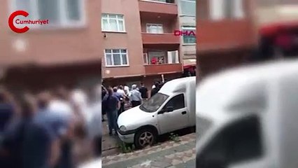 Yangında mahsur kalan anne çocuğunu balkondan aşağı bıraktı