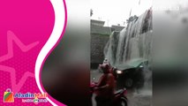 Hujan Deras, Talang Air Meluap Ciptakan Air Terjun di Jalan Bogor