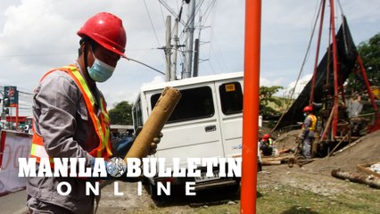 Workers from the People's Republic of China conduct soil sampling for SIDC Project