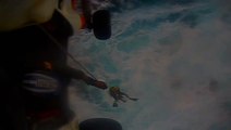 Coast Guard helicopter crew rescue fisherman during tropical storm