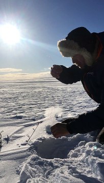 A Big Fish is Pulled from the Ice