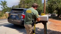 Wildfire evacuees, firefighters face sweltering heat wave