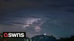 Stunning storm timelapse shows dark-grey clouds rolling over in front of hundreds lightning flashes
