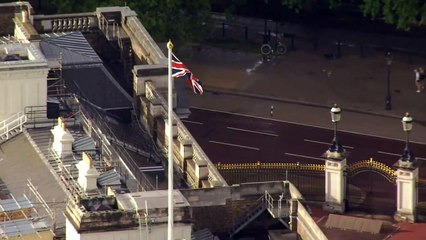 Crowds gather outside gates of Buckingham Palace