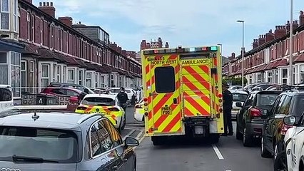 Ambulance at scene of police rooftop stand-off in North Shore, Blackpool on Friday, September 9