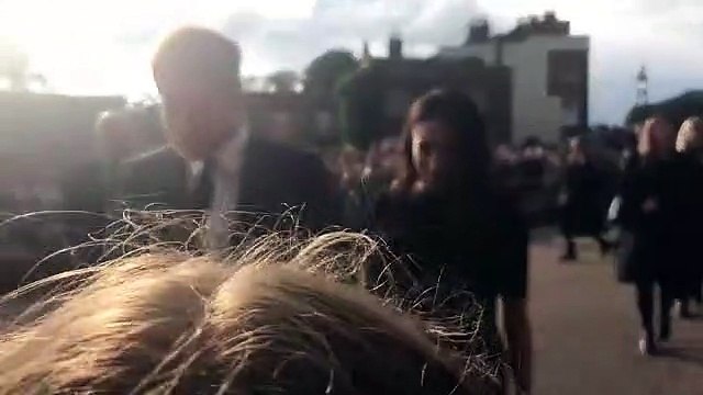 The Duke and Duchess of Sussex greet crowds outside of Windsor Castle