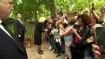 King and Queen Consort greet crowds outside Clarence House