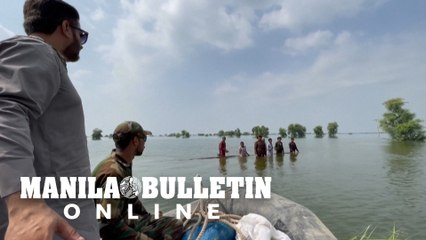 Desperate families evacuated by boat as new inland sea swamps in southern Pakistan