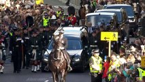 Charles III walks behind Queen's coffin in procession