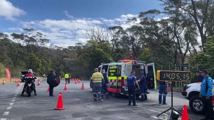 A cyclist crashes during AusCycling Masters and Junior Road National Championships in Wollongong