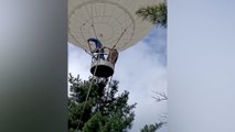 Pine nut picker carried off by hydrogen balloon rescued after 2 days in the wild in China
