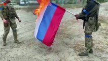 Ukrainian Soldiers Burn Russian Flag as They Reclaim Their Territory